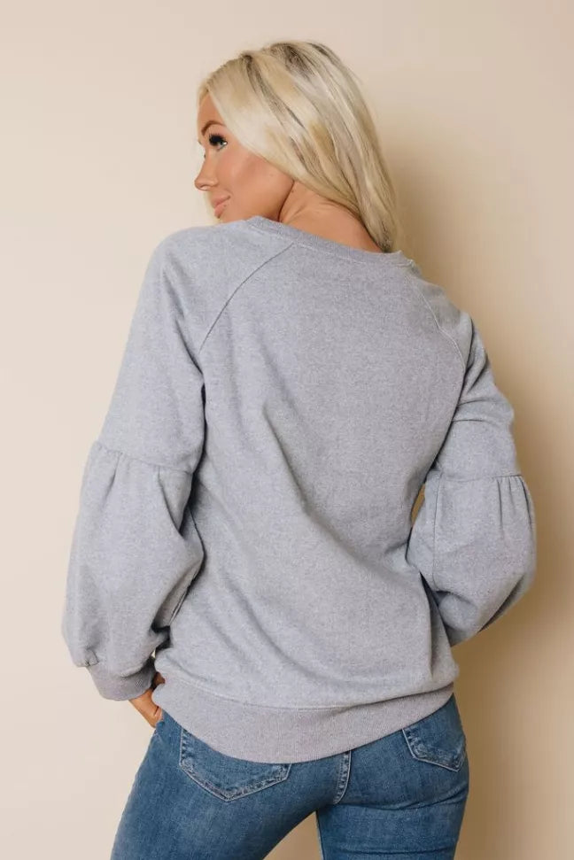Heather gray balloon sleeve sweatshirt, rear view with gathered cuff sleeves.