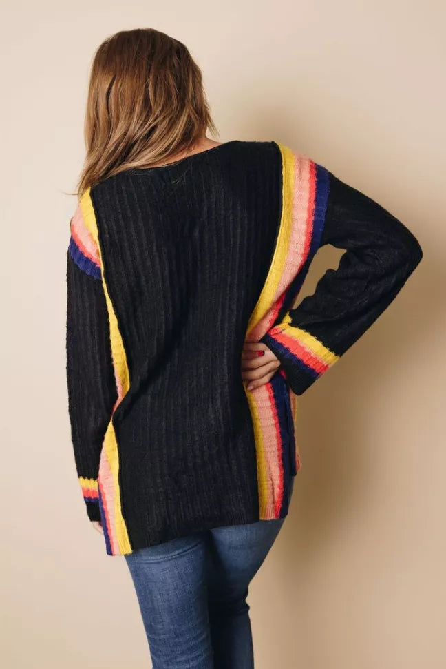 Black knit sweater back view with rainbow vertical stripe and ribbed hem