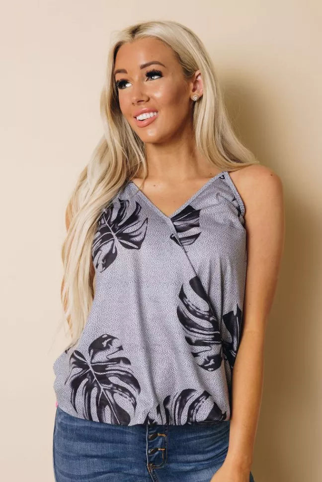 Grey sleeveless V-neck tank top with black leaf print