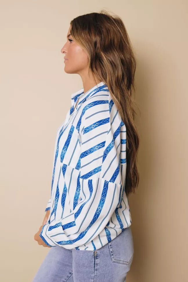 Blue-and-white striped button-down shirt, side view, long sleeves