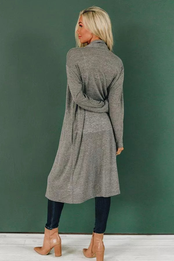 Gray slouchy knit cardigan with wrap-style drape and tie waist