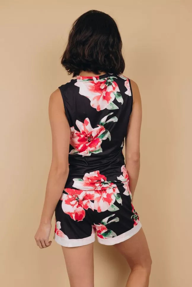 Back view of floral loungewear set with sleeveless black top and floral shorts