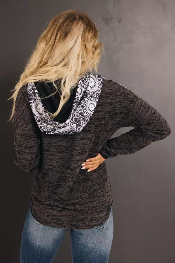 Dark heather hoodie with tribal-lined hood and kangaroo pocket