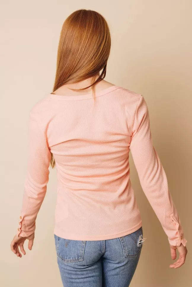 Light pink long-sleeve henley top, back view with gathered seam detail at shoulders
