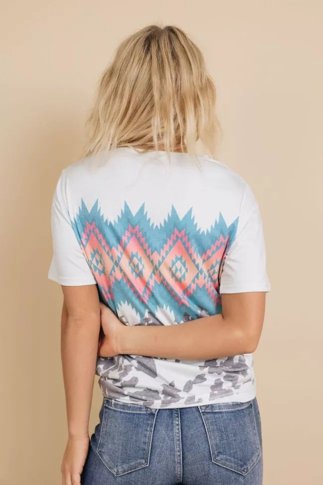 White crewneck tee with multicolor aztec geo print and gray silhouette design on back