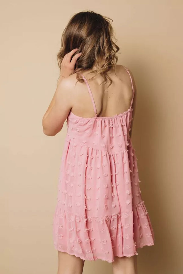 Pink textured mini dress, thin spaghetti straps, gathered tiered back