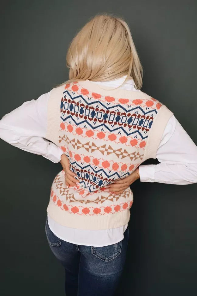 Knitted sweater vest back with tribal geometric pattern, cream with coral and navy