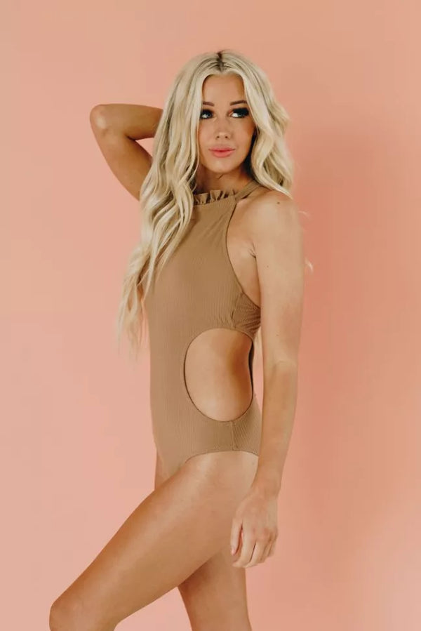Brown one-piece swimsuit with high neck and oval front cut-out