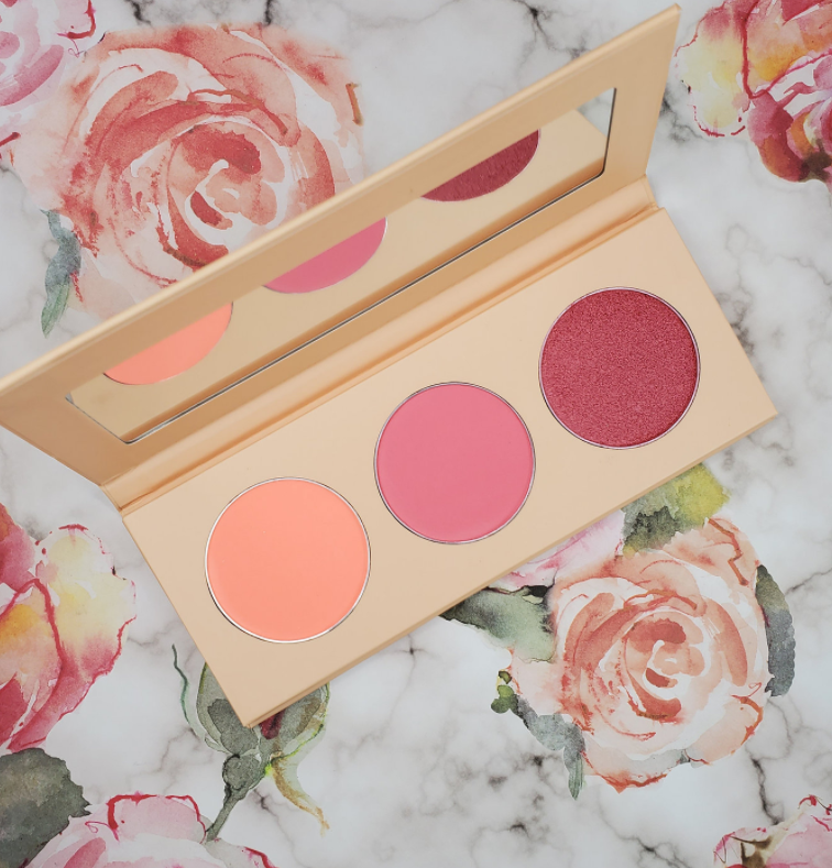 Three-pan blush palette with circular pink and rosy-red pans, open case