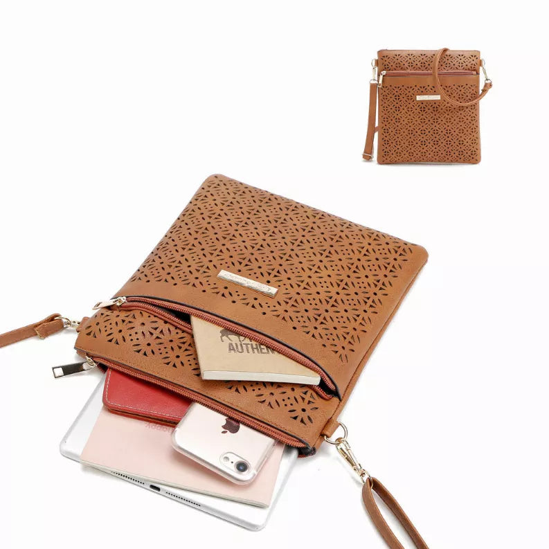 Orange cutout flower handbag clutch with fold-over top and wrist strap