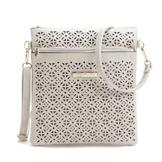 White cutout flower crossbody handbag with top zipper and front perforated panel