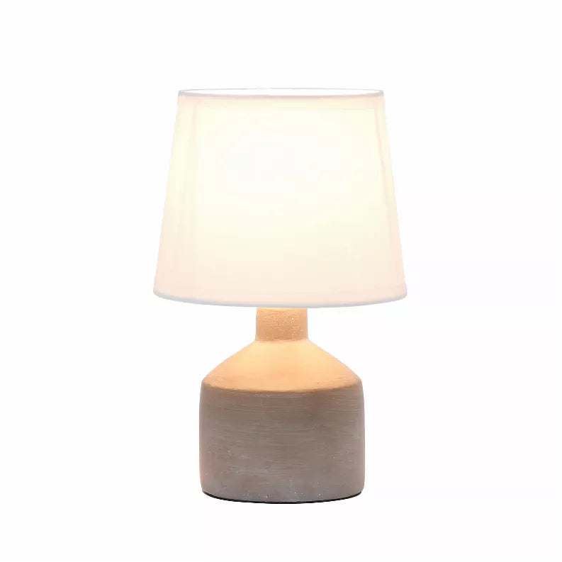Mini ceramic table lamp with white shade and gray textured base