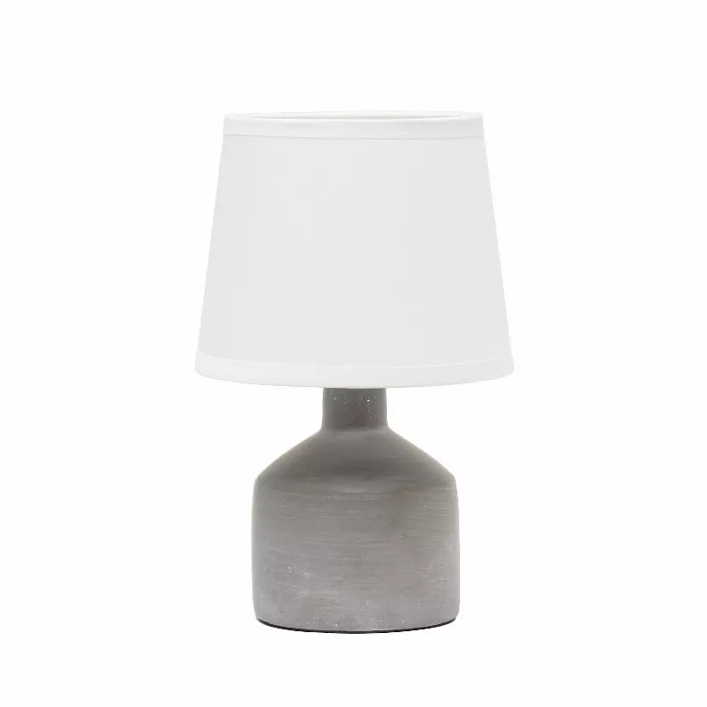Mini ceramic table lamp with white fabric shade and gray base