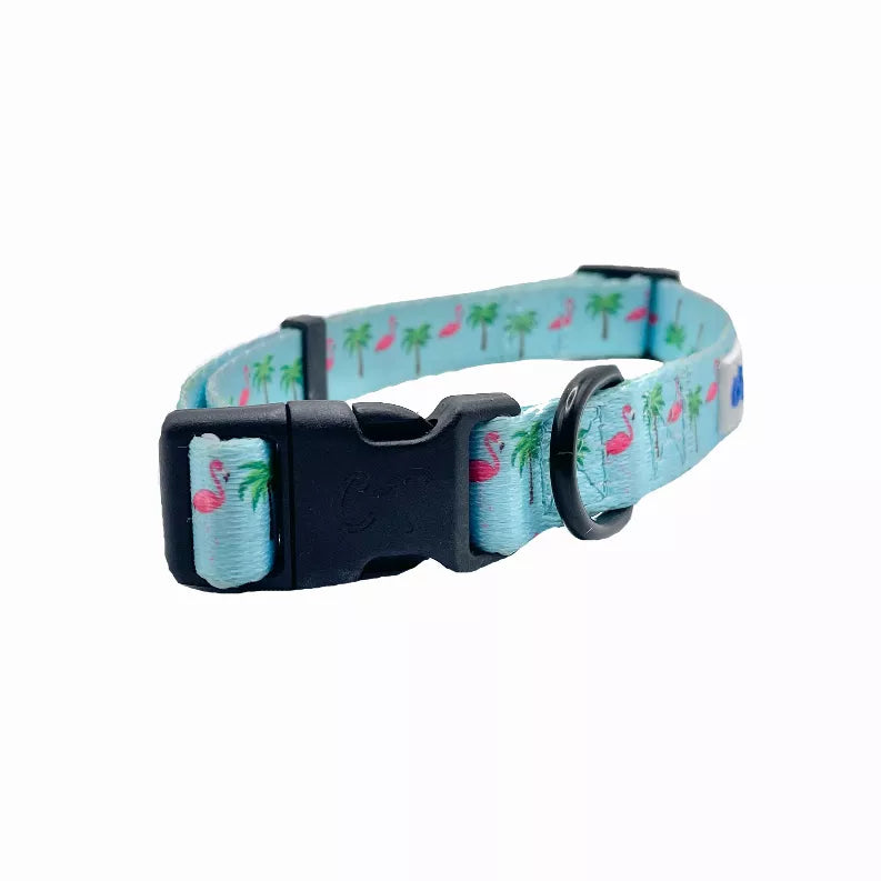 Light blue dog collar with flamingos and palm trees; black buckle and metal D-ring detail