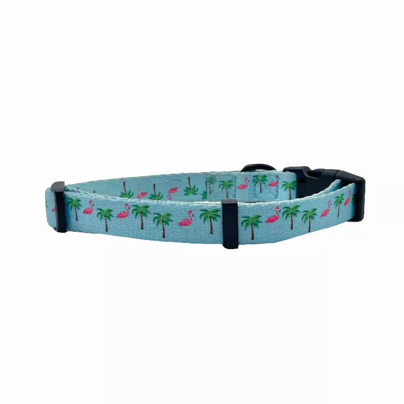 Light blue flamingo and palm tree dog collar with black strap and buckle, side view