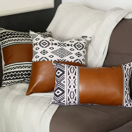 Throw pillow cover set: brown faux leather-look and white geometric patterned throw pillows
