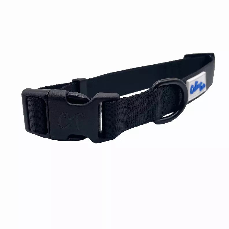 Navy dog collar with woven strap, metal ring buckle, and logo patch