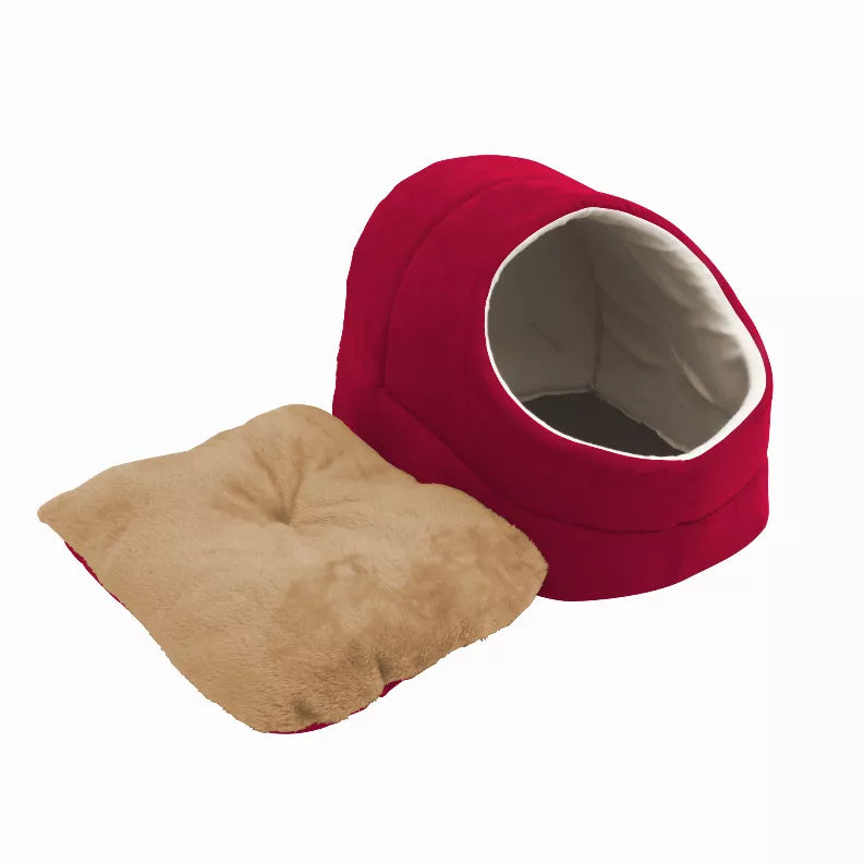 Red cat cave bed with cream-trim entrance and beige warming cushion on white background