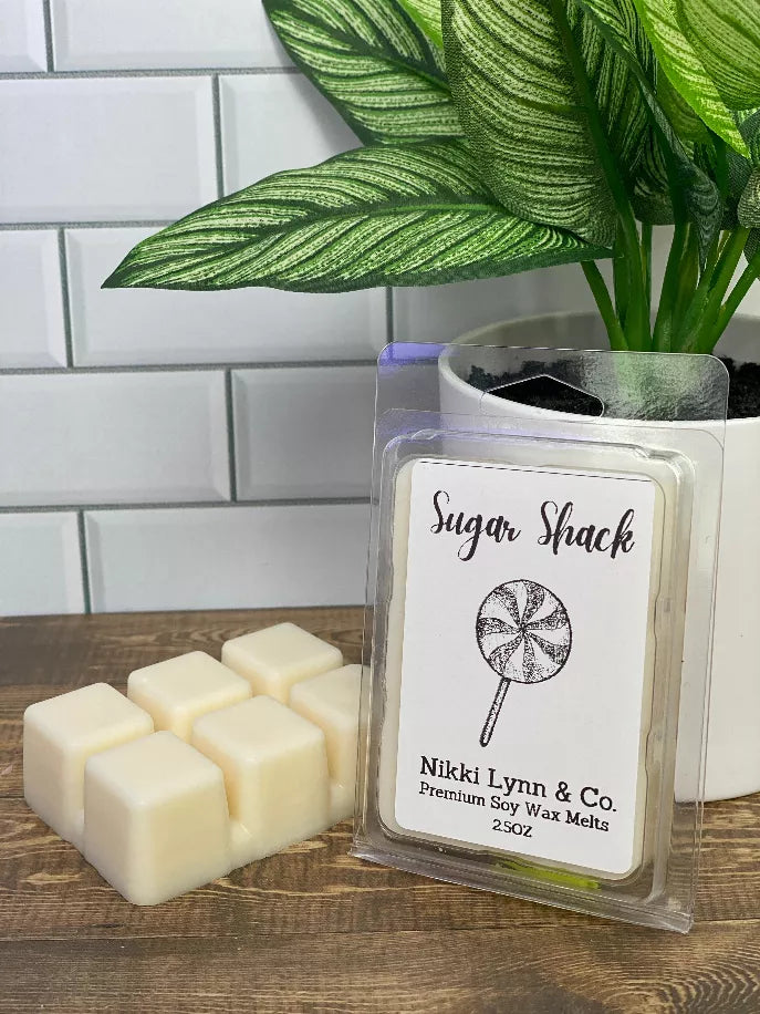 Sugar Shack sugar wax melts pack: clear clamshell with white cubes and lollipop label.