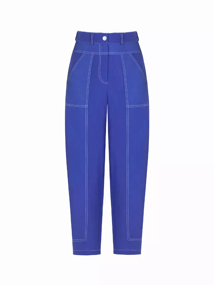Blue linen carrot pants, front view, button waistband and patch pockets