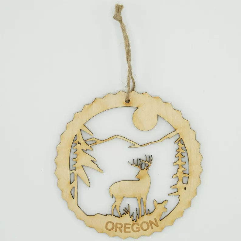 Unfinished wood deer tree ornament with Oregon text and pine scene, hanging loop