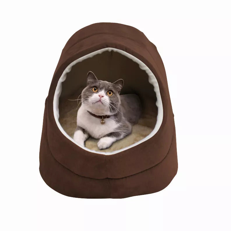 Brown cat cave bed with oval entrance and light trim, gray cat resting inside