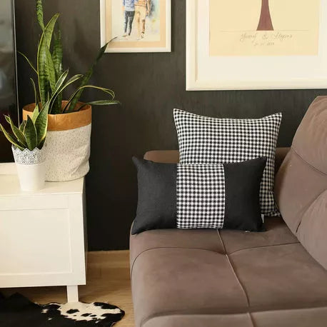 Set of two throw pillows: dark gray with vertical houndstooth panel and check pillow