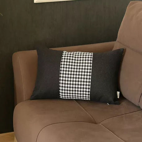 Dark gray throw pillow with vertical black-and-white houndstooth jacquard stripe