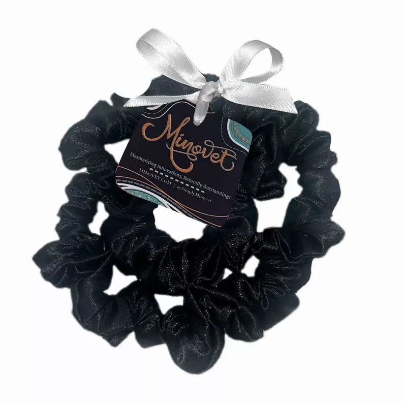 Black satin scrunchie with gathered ruffle loops and bow fabric tag