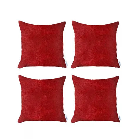 Set of four red faux leather throw pillows, square with smooth textured surface