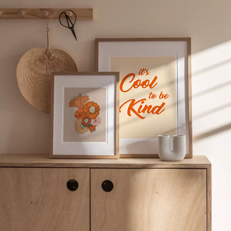 Framed wall art set with orange motivational text "It’s Cool to be Kind"