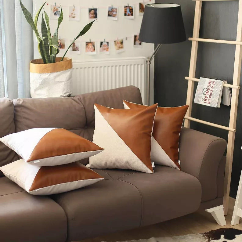 Set of 4 faux leather throw pillows, brown and tan geometric accents