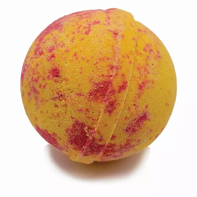 Yellow round bath bomb with red swirl speckles
