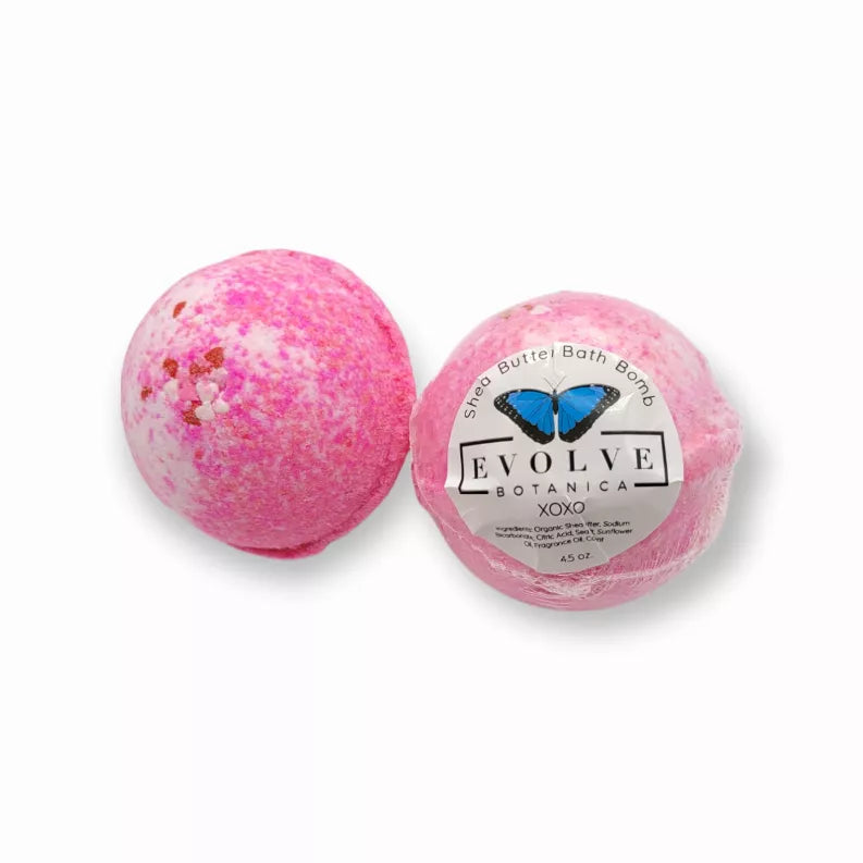 Pink speckled bath bomb with smooth round shape