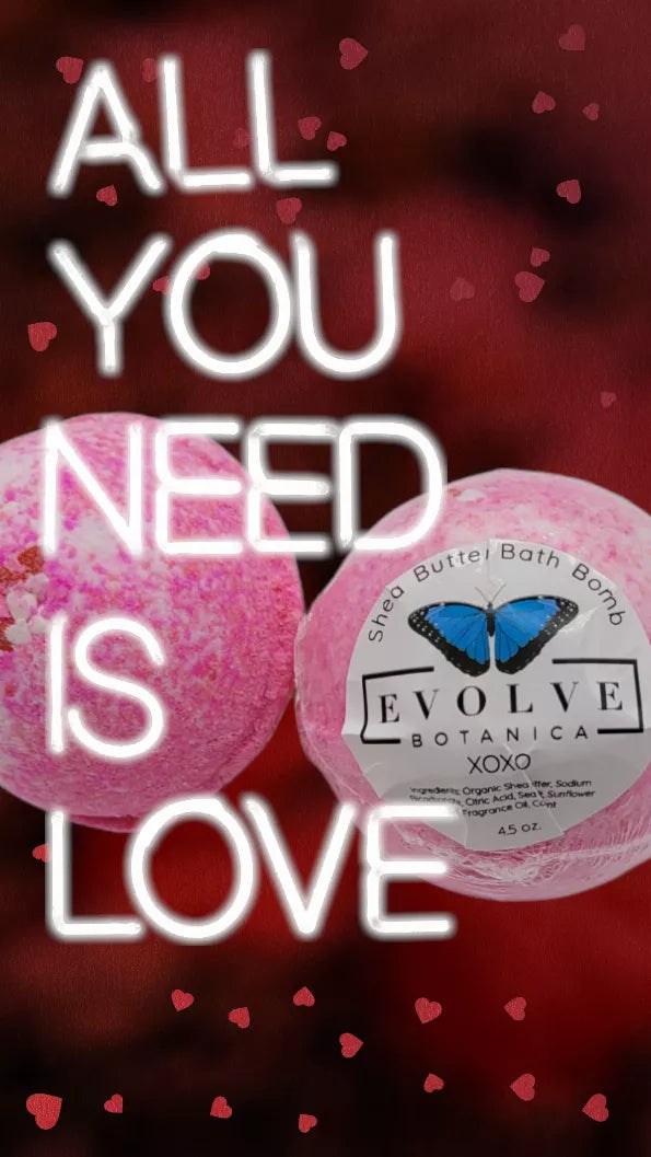 Pink bath bomb with round label, heart-themed design