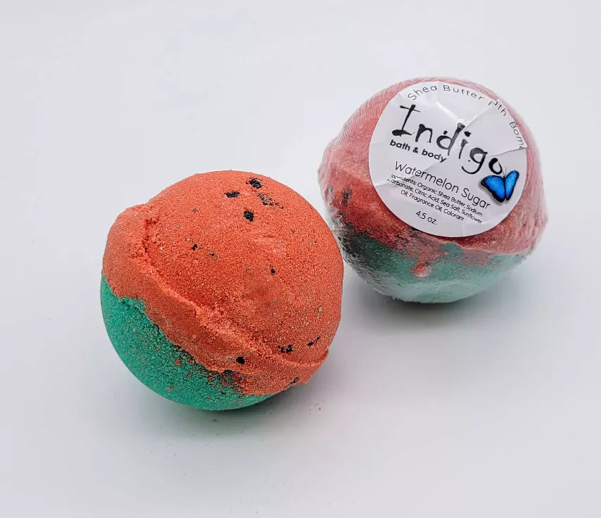 Orange and green teal bath bombs with round shapes and label