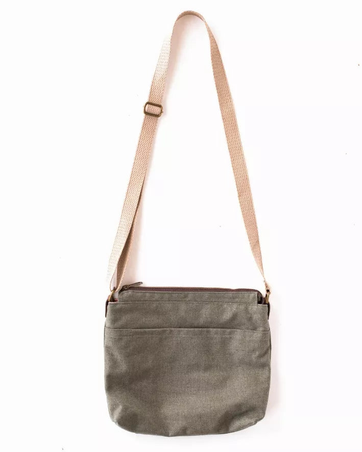 Olive crossbody bag with adjustable strap and zippered pocket
