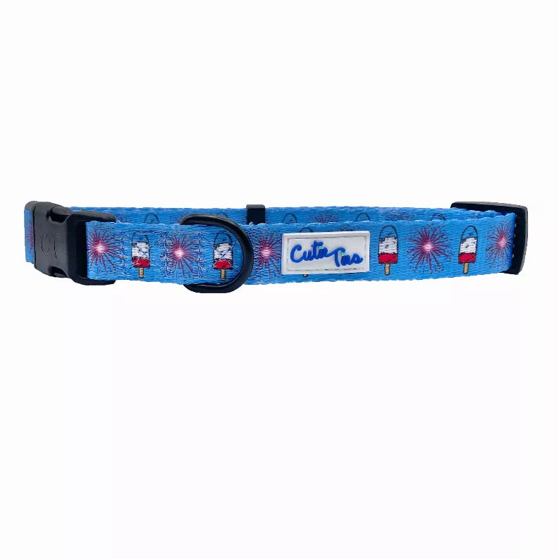 Blue dog collar with black hardware, D-ring, and Cutie Ties logo patch