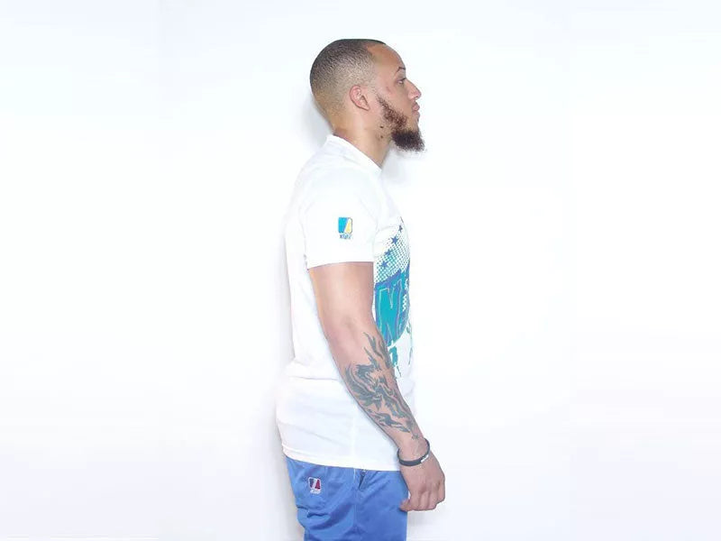 White sports T-shirt sleeve showing small blue patch graphic