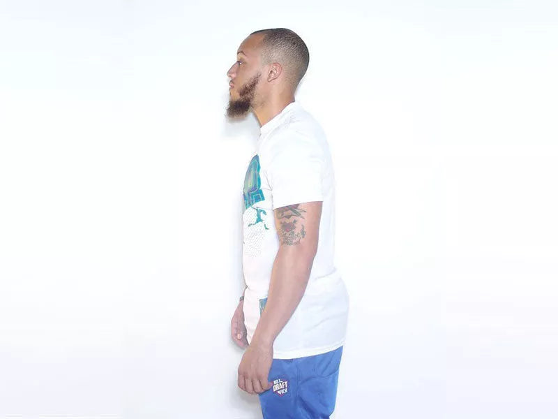 White sports T-shirt in side profile with blue graphic detail on the sleeve