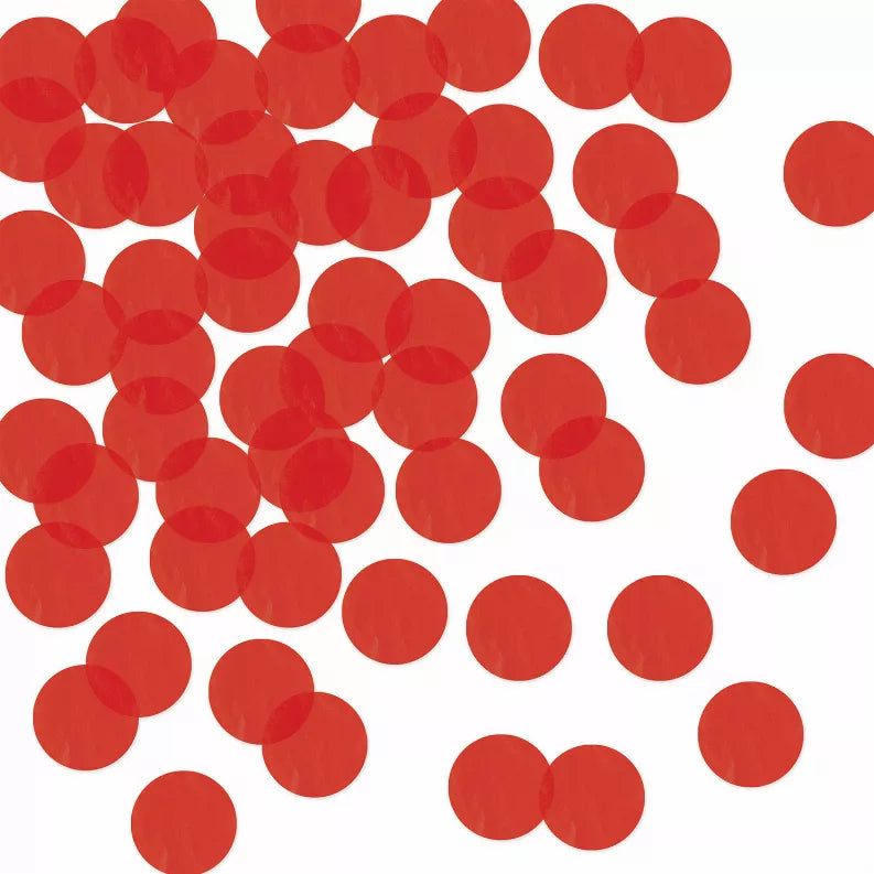 Red tissue paper circle decorations, scattered across a surface