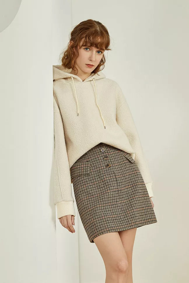 Dark gingham mini skirt with button front and structured yoke detail.