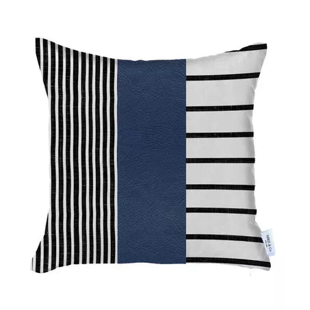 Pillow cover with navy-blue panel, black-and-white stripes; small logo tag on right corner