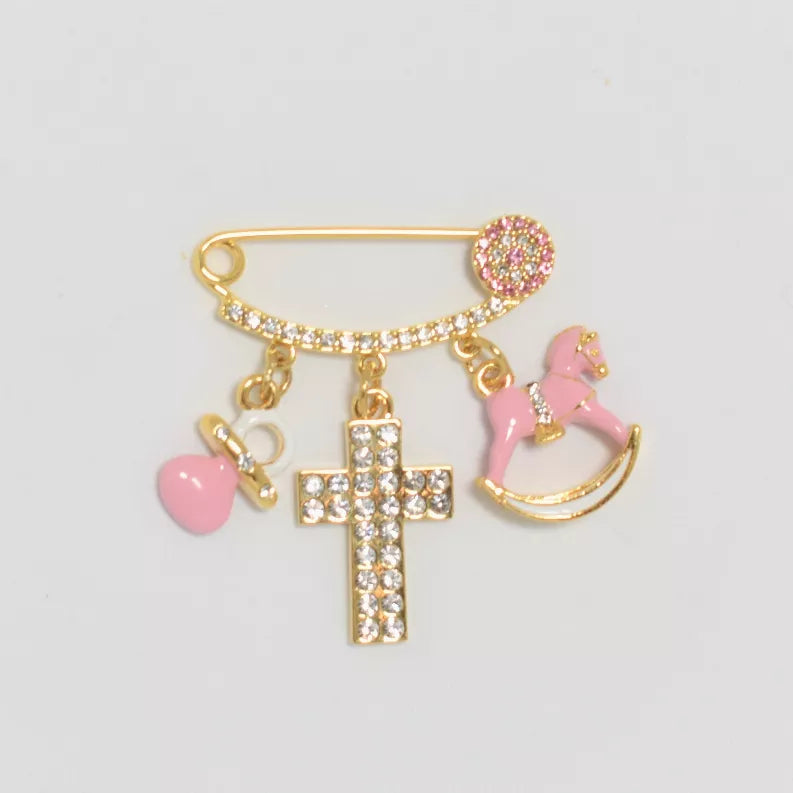 Gold baby pin with rhinestone round clasp and pink heart, cross, and rocking horse charms