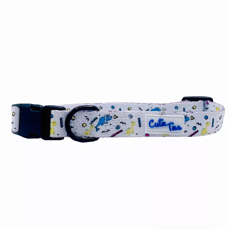 Dog collar with light gray webbing, colorful dinosaur and confetti print, black buckle