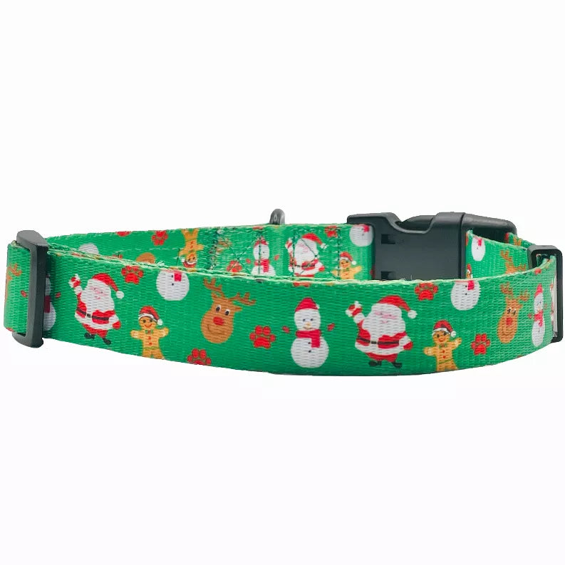 Green dog collar with holiday character print and black plastic buckle and D-ring.