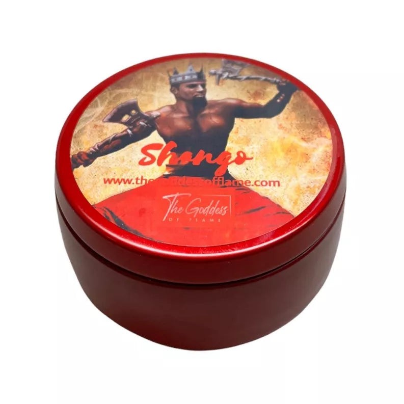 Round candle tin with red rim and Shango graphic on the lid