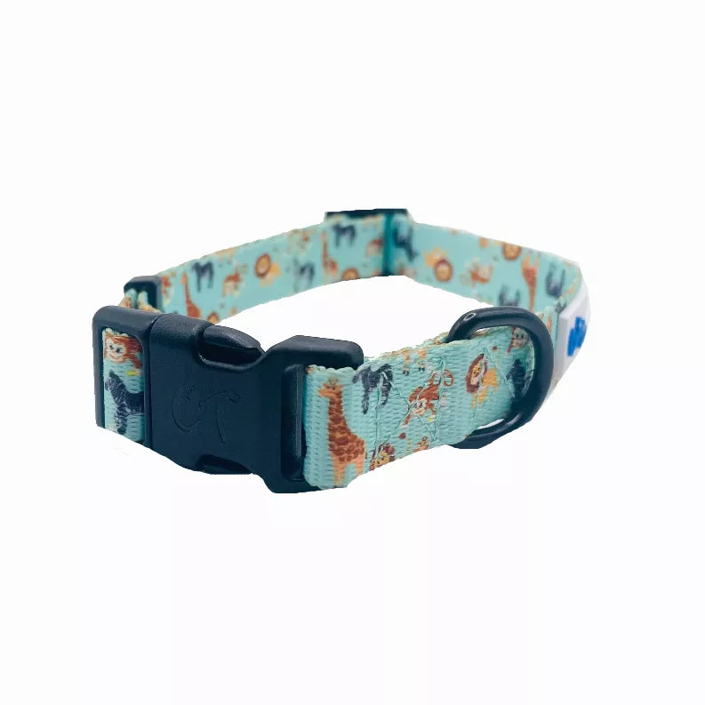 Blue-green dog collar end view with navy buckle and ring, jungle animal pattern