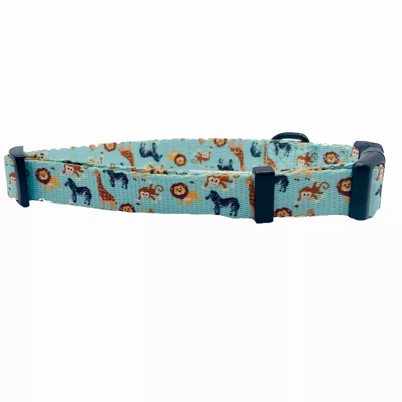 Turquoise dog collar with navy buckle, featuring jungle animal print fabric