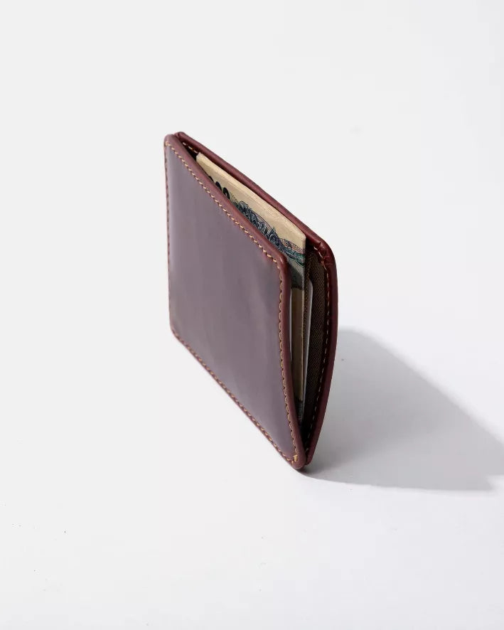 Maroon slim bifold wallet with contrast stitching and visible card slot with inserts.